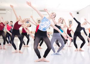 Studio full of students practicing a contemporary routine
