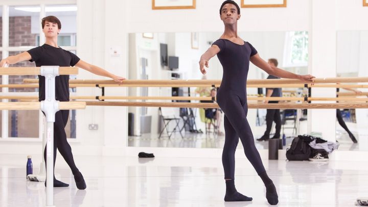 Two students dance in the studio as part of an Online Intensive course