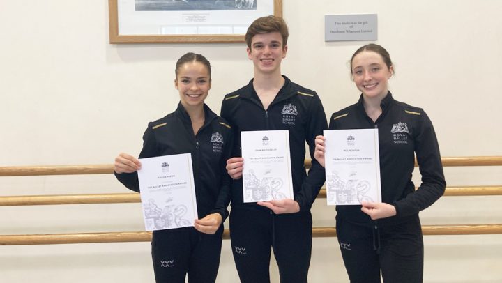 Students holding certificates